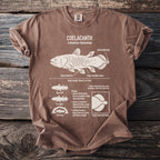 Brown t-shirt with white graphic of coelacanth fish, its anatomy, and biology.