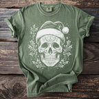 Green t-shirt with a white distressed sugar skull wearing Santa hat, surrounded by holly.