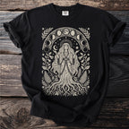 Black t-shirt with a cream-colored celestial woman and moon phase art.