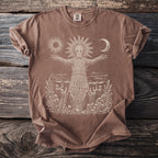 Brown t-shirt with a wicker figure, sun, moon, and figures holding candles.