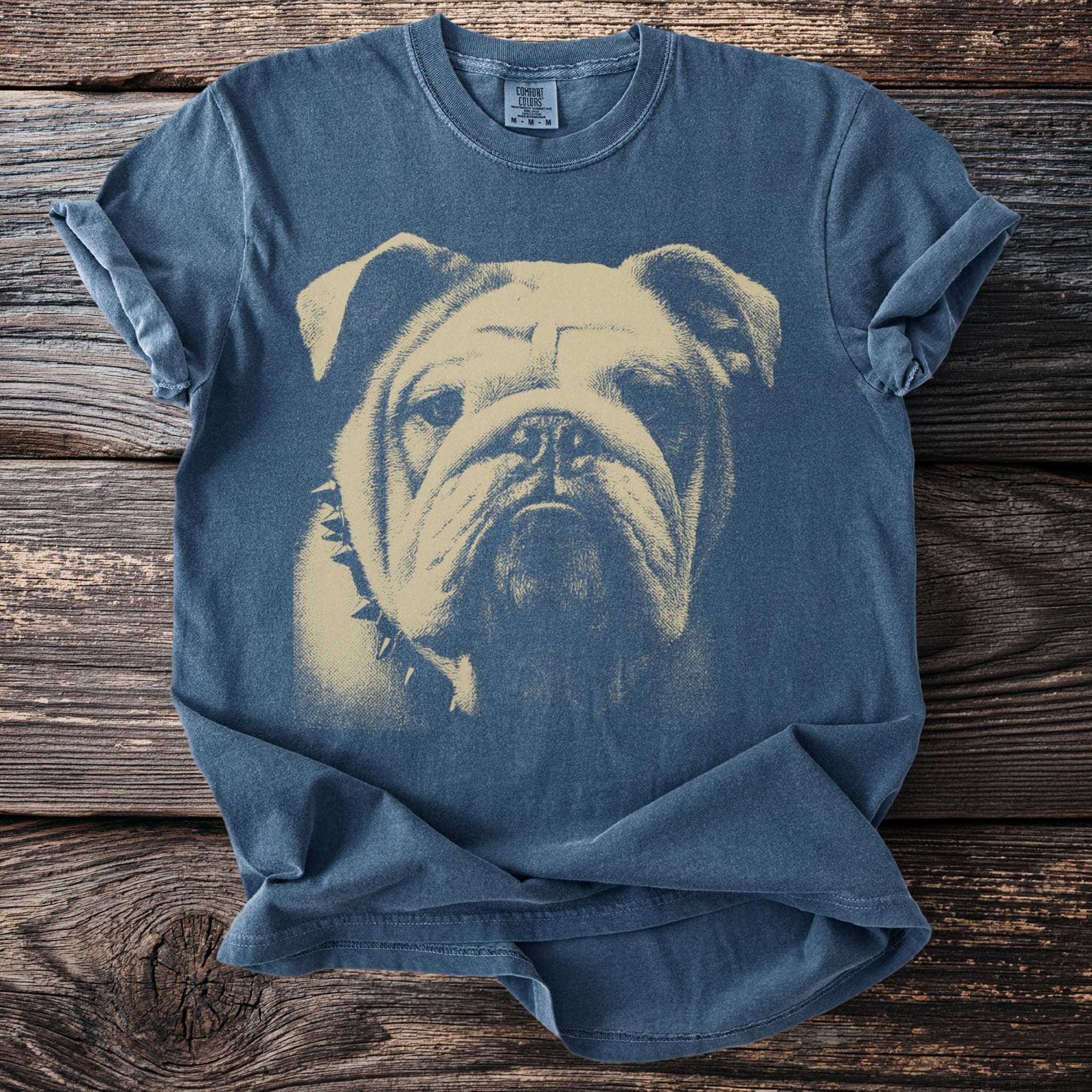 Blue t-shirt with a tan bulldog graphic and a spiked collar.