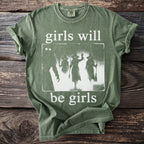 Green t-shirt with "girls will be girls" text and witch silhouettes design.