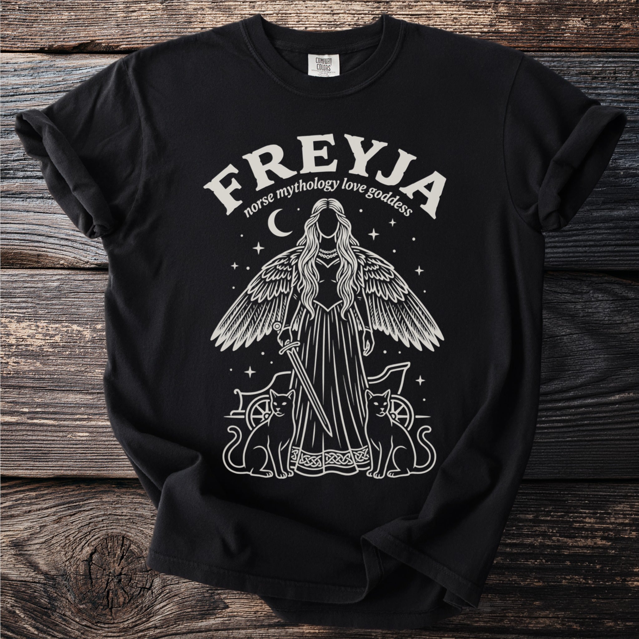 Black t-shirt with a white graphic of Freya, Norse goddess, with cats and a chariot.