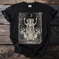 Black t-shirt with a woodblock print of three witches holding torches with dogs and keys.