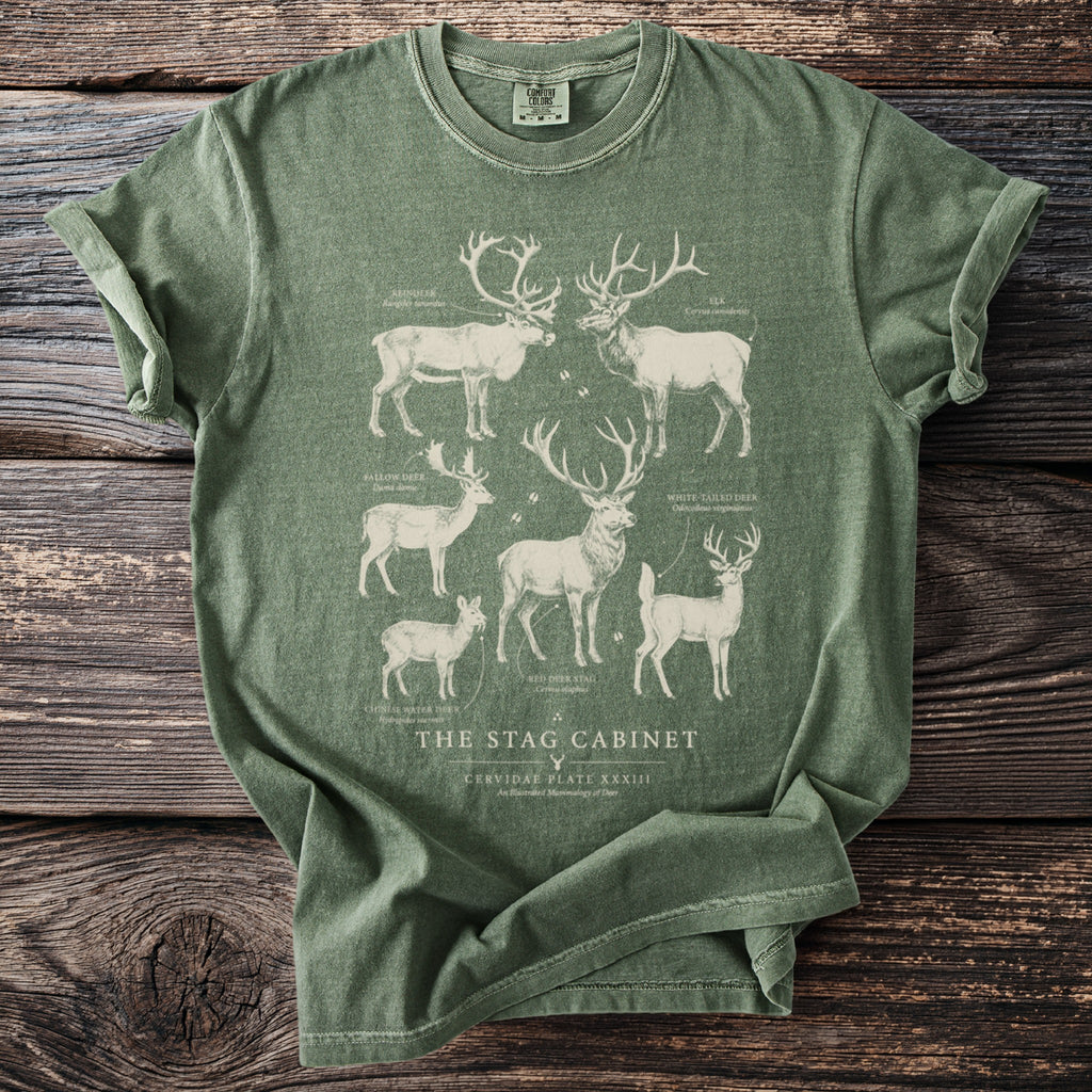 Green t-shirt with illustrated deer and text: The Stag Cabinet.