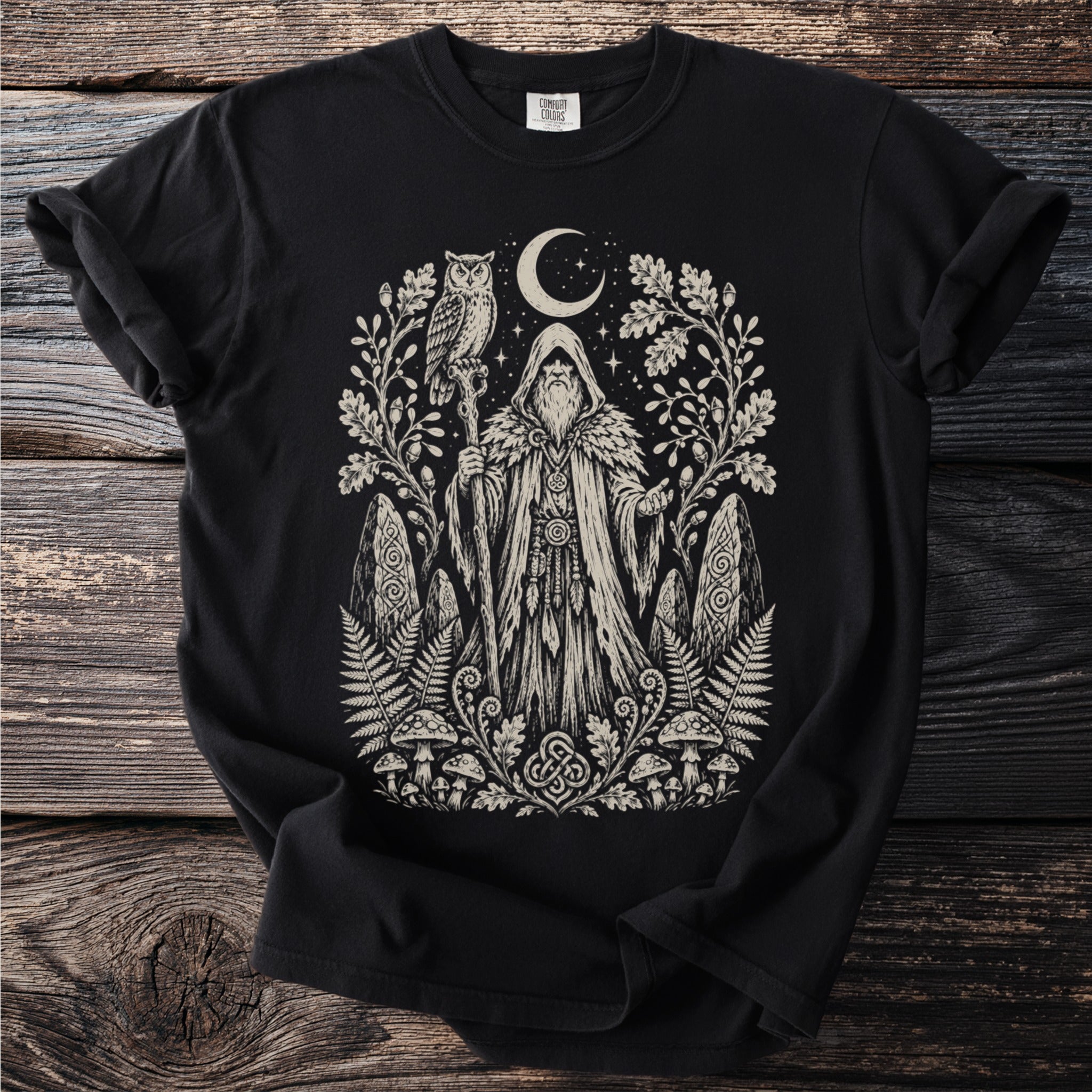 Black t-shirt with a woodland wizard, owl, moon, and mystical symbols.
