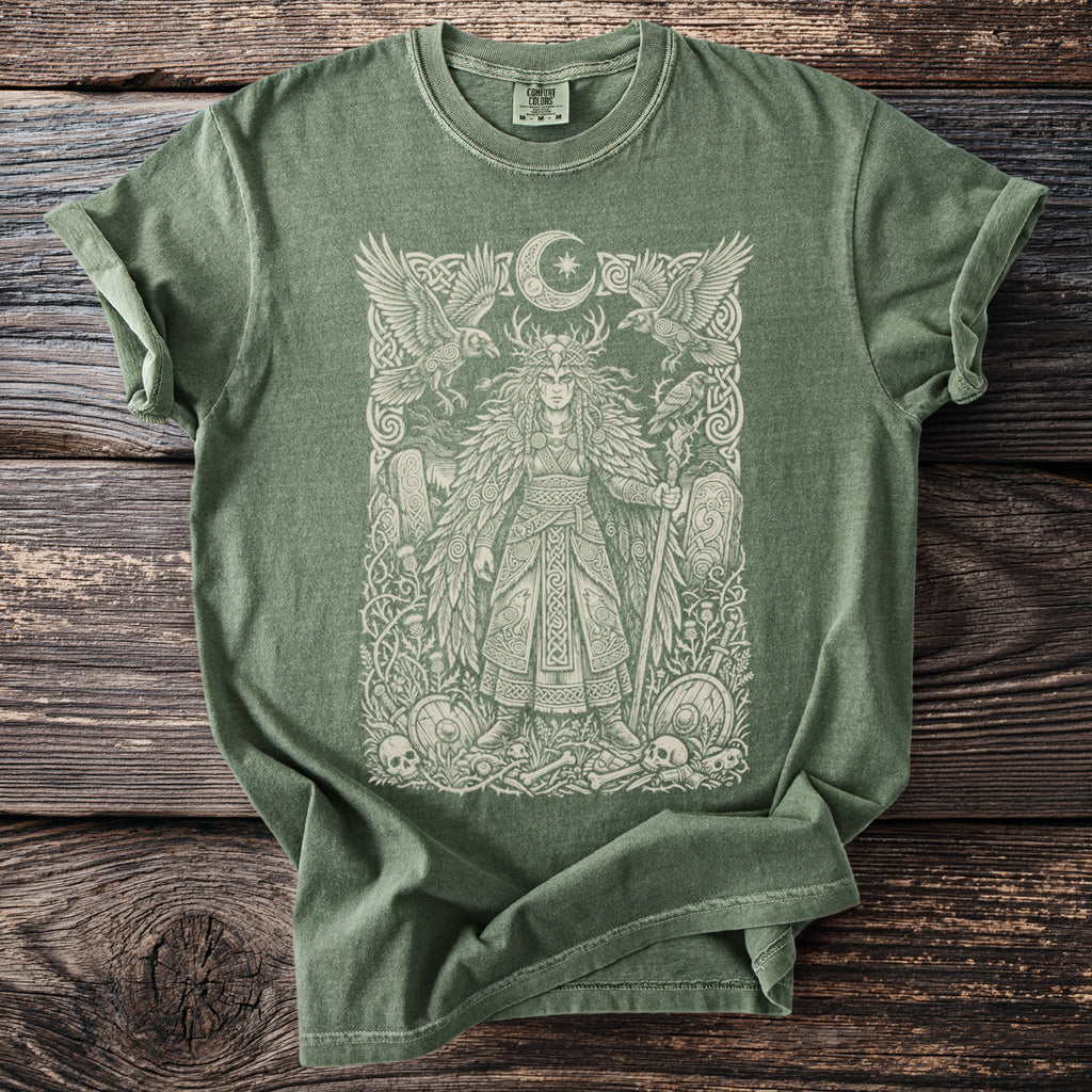 Green t-shirt with a pale graphic of a warrior woman, ravens, and a moon.