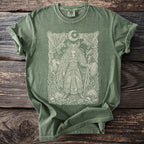 Green t-shirt with a pale graphic of a warrior woman, ravens, and a moon.