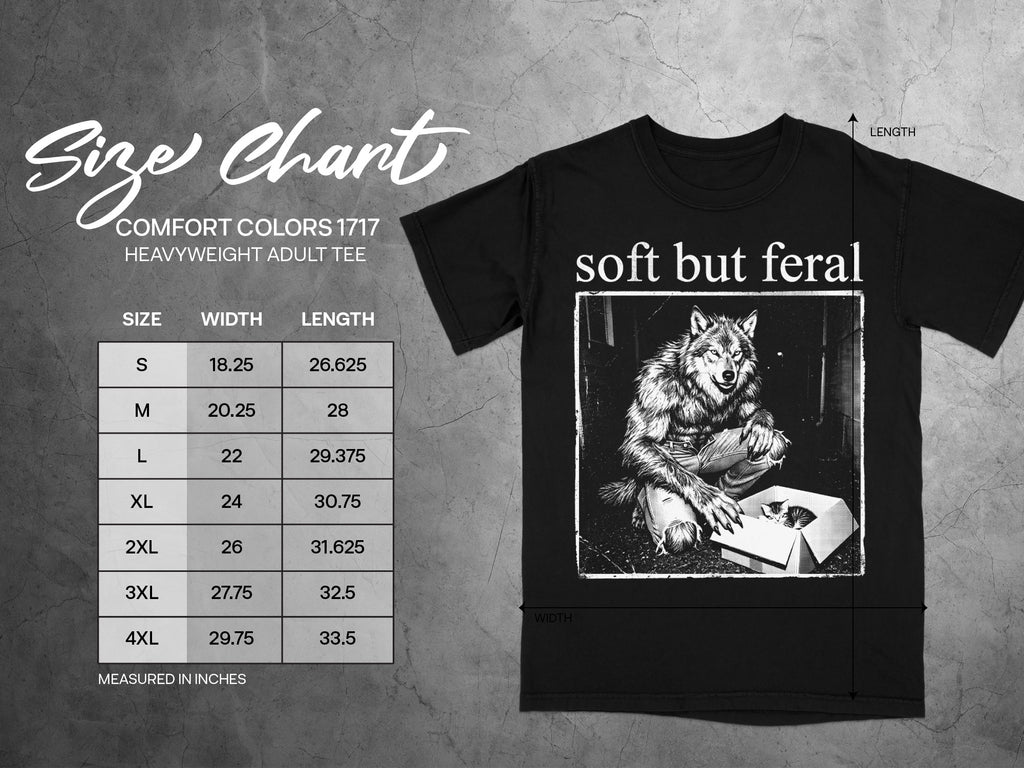 Black t-shirt with "soft but feral" text and werewolf holding kitten in a box graphic.