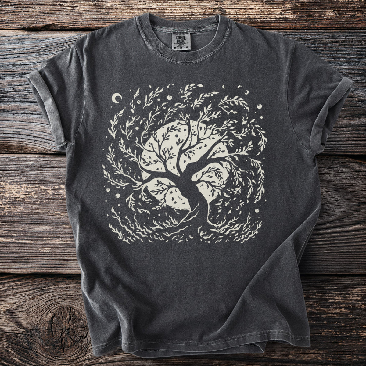 Dark gray t-shirt with a cream graphic of a black cat in a witch hat, full moon, bats, and curling smoke.
