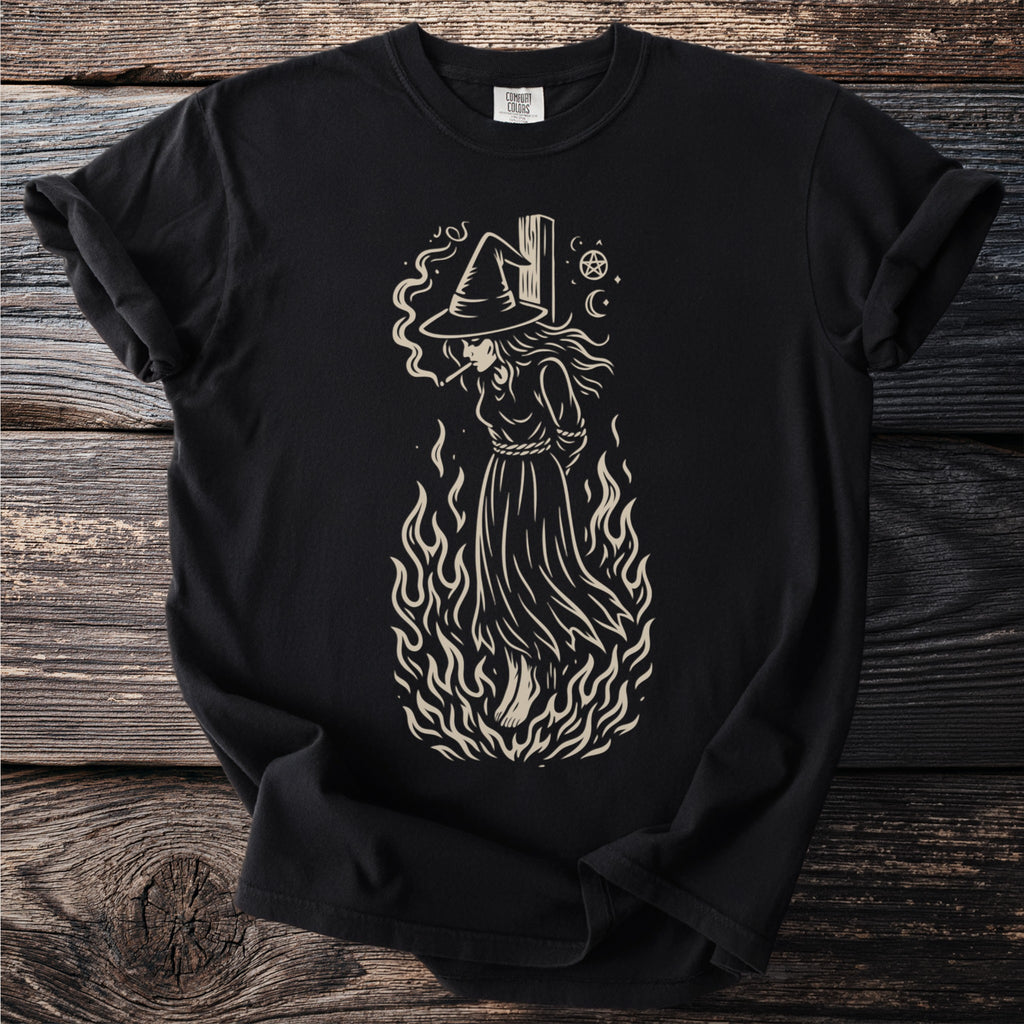 Black t-shirt with a light-colored graphic of a witch in flames smoking.