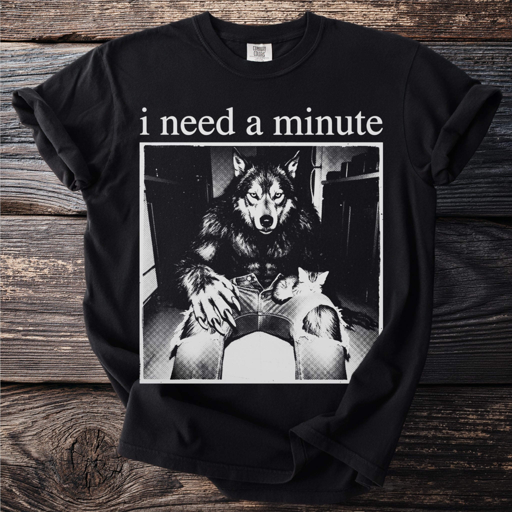 Black t-shirt with "i need a minute" and a werewolf holding a kitten.