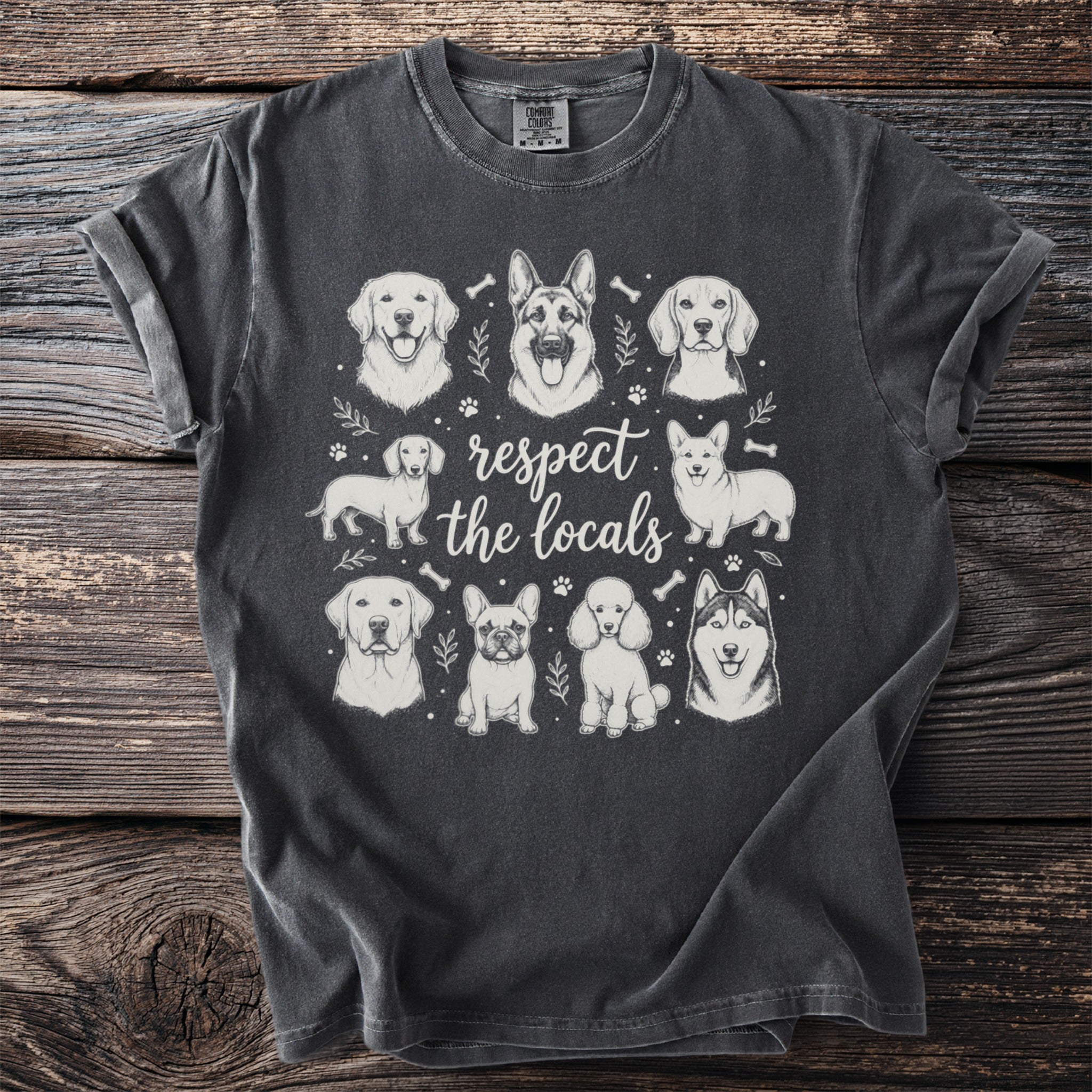 T-shirt with sketch art of various dog breeds and text "respect the locals."