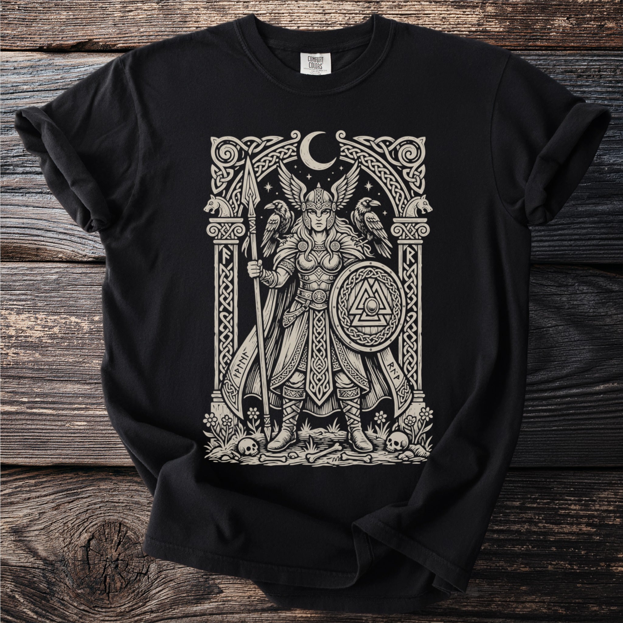 Valkyrie with spear and shield, ravens, moon, bones, and knotwork design on black t-shirt.