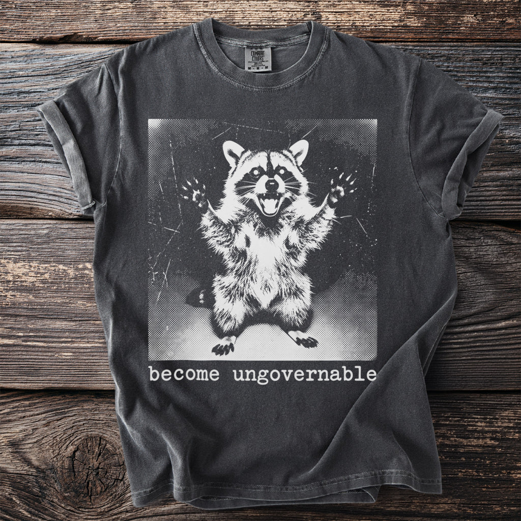 Dark grey t-shirt with graphic of a wide-eyed raccoon and text "become ungovernable".