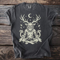 Dark t-shirt with a beige illustration of a seated figure with deer antlers and ram horns.