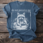 Tee with raccoon in trash bin graphic and text "do not perceive me."