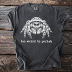 Dark t-shirt with a white jumping spider graphic and the text "too weird to perish".