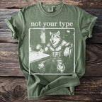 Green t-shirt with "not your type" and a werewolf drinking coffee graphic.