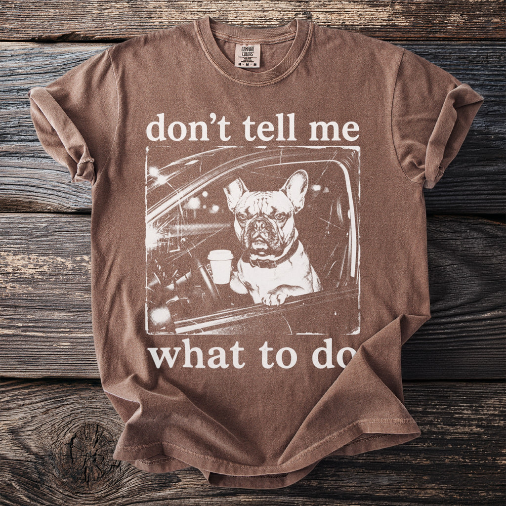 Brown t-shirt with a French bulldog in a car holding coffee; "don't tell me what to do."