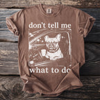 Brown t-shirt with a French bulldog in a car holding coffee; "don't tell me what to do."