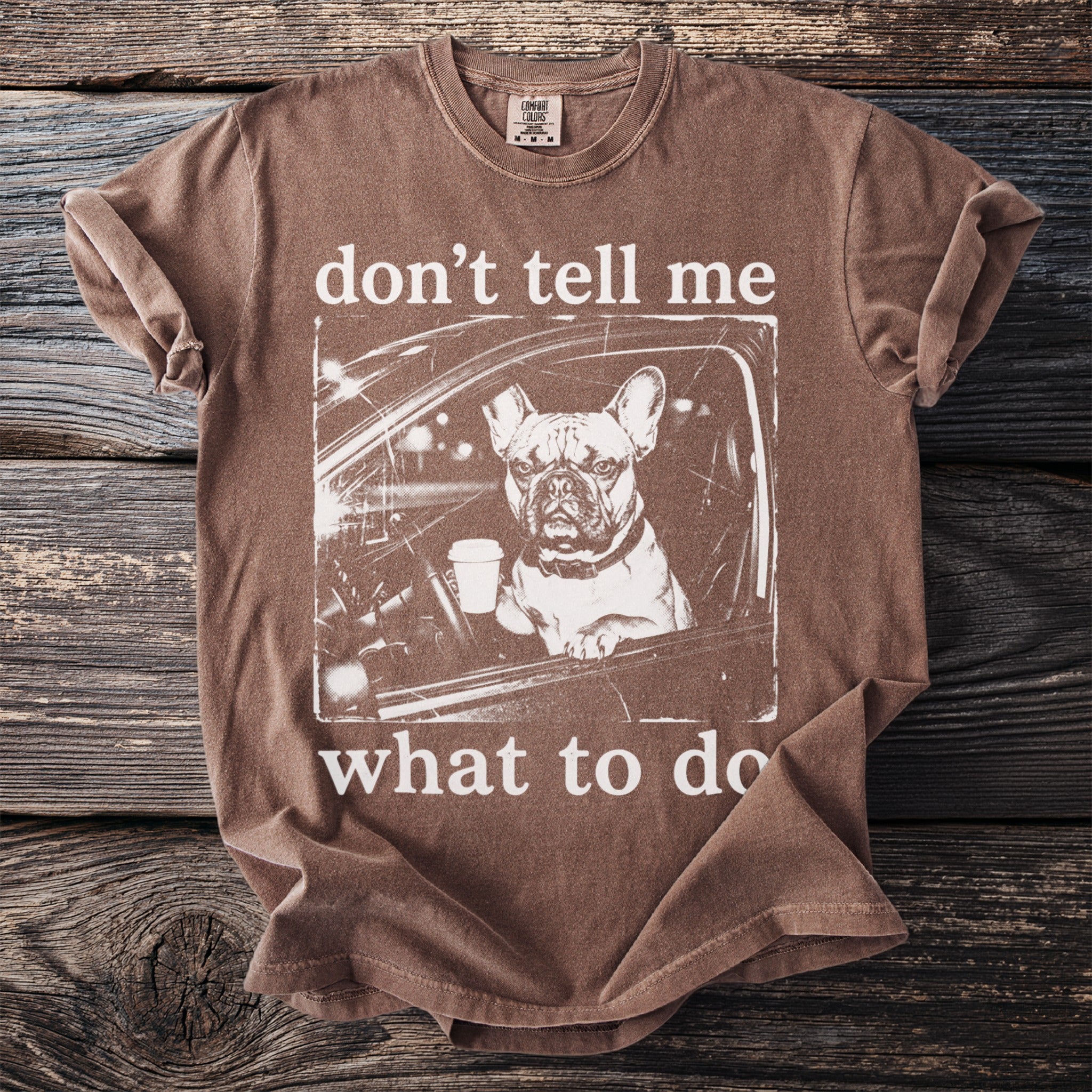 Brown t-shirt with a French bulldog in a car holding coffee; "don't tell me what to do."