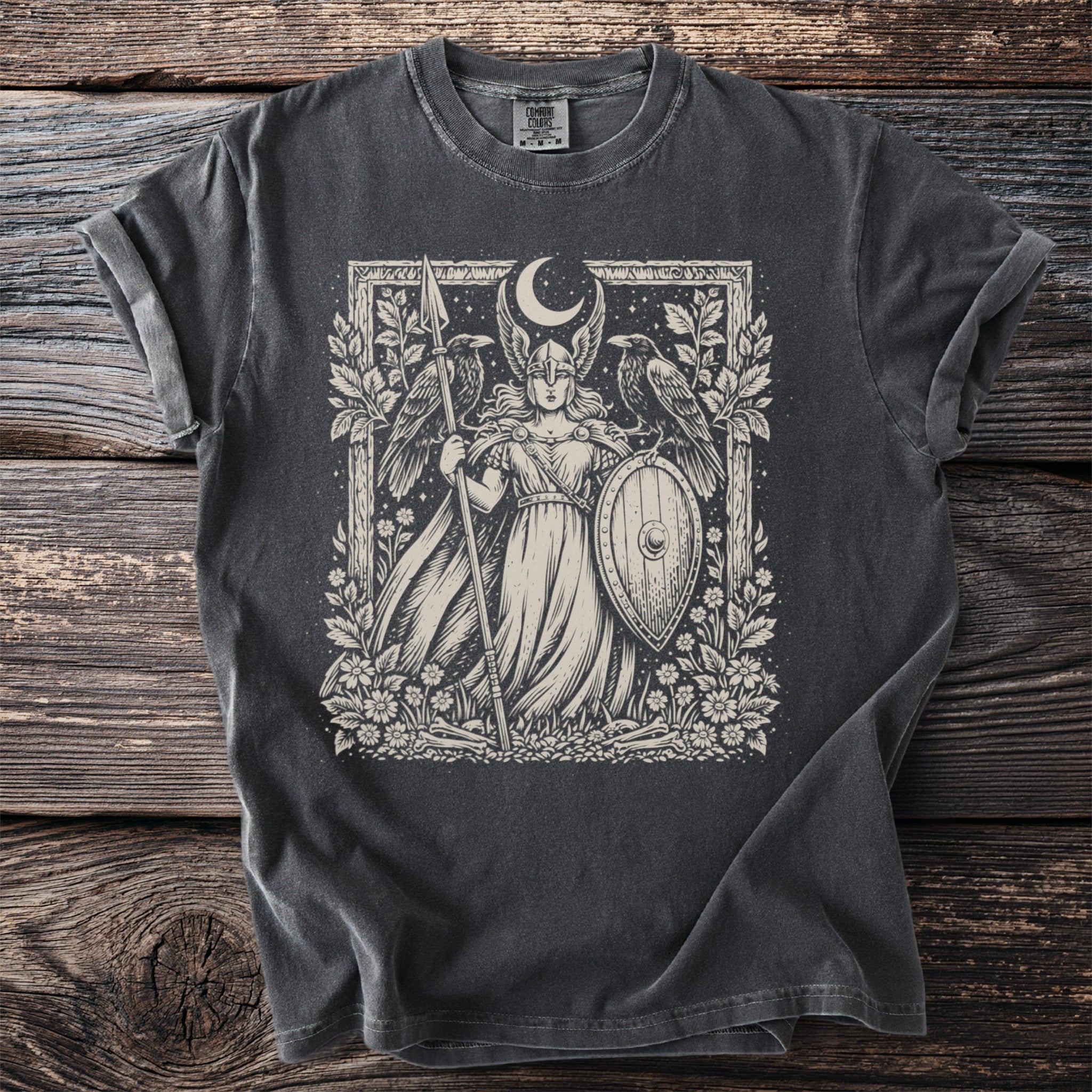 Dark grey t-shirt with a light-colored graphic of a warrior woman with ravens and a moon.