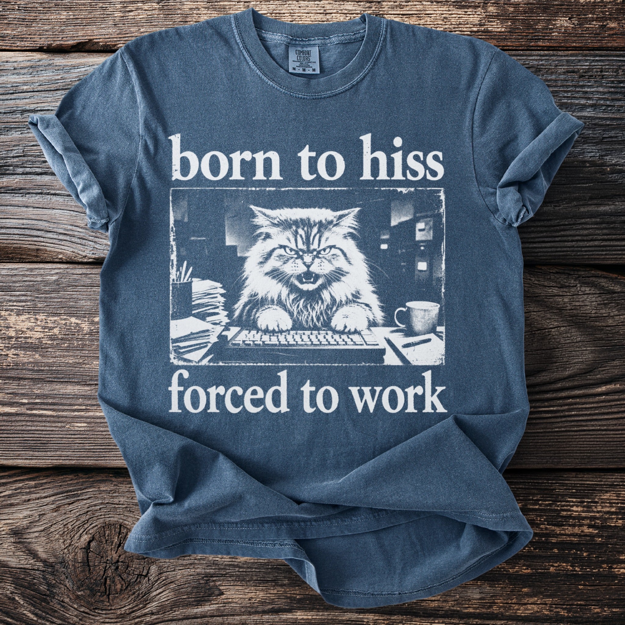 Blue t-shirt with white text and graphic of an angry cat at a computer.